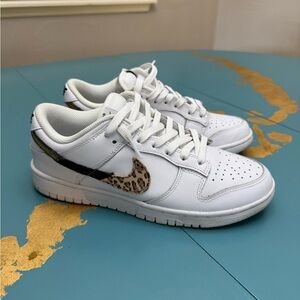 Women's Nike Dunk Low with animal print swish. Size 8.5
